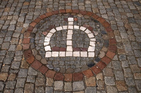 Motif of a crown in street pavement, paving stones, old town, Wangen im Allgäu, Bavaria, Germany