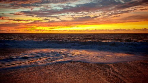 Peaceful seaside sunset with soft waves and richly coloured evening sky, romantic, Tarrafal de