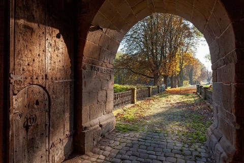 Old mighty wooden entrance gate to Bladenhorst Castle in autumn, Castrop Rauxel, Ruhr area, North