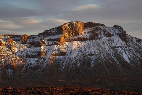 Mirador El Tabonal Negro, Caldera, mountain landscape with snow-covered rocks in the golden hour of