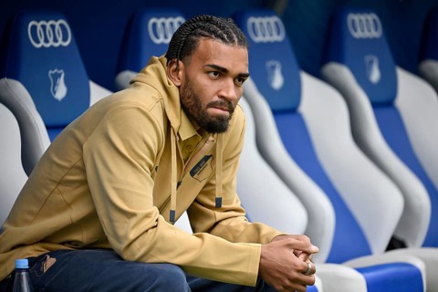 Kevin Akpoguma TSG 1899 Hoffenheim (25) sits thoughtfully on the substitutes' bench Bundesliga