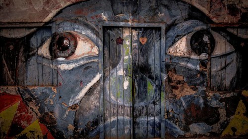 Wall painting on façade and door, graffiti, mural of a face with big eyes, Ponta do Sol, Santo