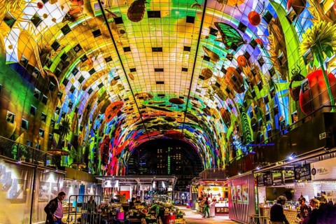 Markthal from 2014, offers over 100 food stalls and delicatessens with spectacular ceiling fresco