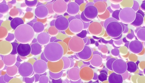 A whimsical scene of floating, colorful balls in shades of purple, pink, and yellow. The lively