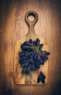 Bunch of black grapes, kishmish variety, black finger, ophelia, Annushka