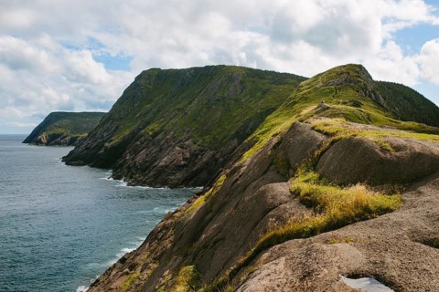 Panoramic view of the rugged cliffs and ocean at Signal Hill, Middle Cove, Newfoundland & Labrador,