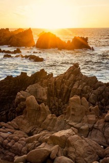 Red rocks by the sea, sunset, Costa Paradiso, Sardinia, Italy