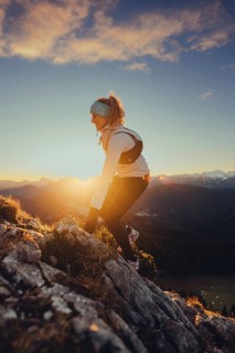 Trail running in autumn on the Jochberg on Lake Walchensee against the wonderful backdrop of the