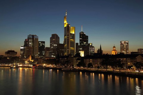 Skyline with skyscrapers and banks of the Main of Frankfurt at dusk, night view, blue hour, river,
