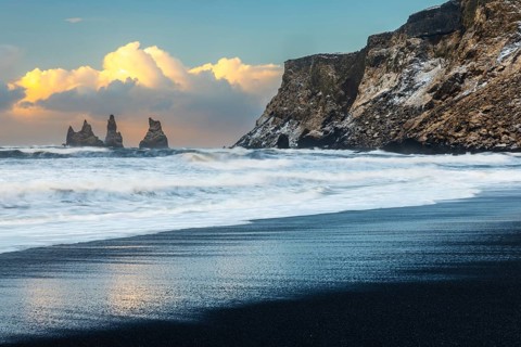 Reynisdrangar pinnacles, lava sandy beach, water, waves, sea, clouds, winter, Vik, Iceland,