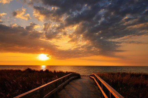 Wooden walkway through the dunes on the Baltic Sea at sunrise, Dahme, Ostholstein, Germany