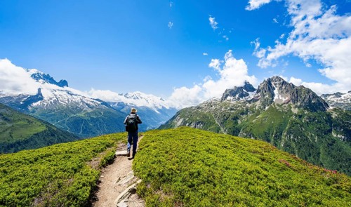 Mountaineers on hiking trail, mountain panorama with glaciated mountain peaks, Aiguille du Midi and