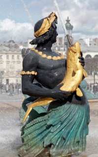 Water-breathing figure with fish at the Fontaine des Mers by Jacques Hittorff, cast iron fountain