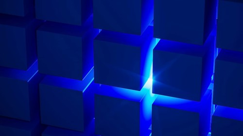 Cube structures create a captivating geometric arrangement highlighted by blue light, showcasing