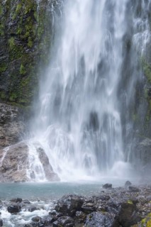 The Devils Punchbowl waterfall falls down a rock face. Arthurs Pass National Park, Canterbury South