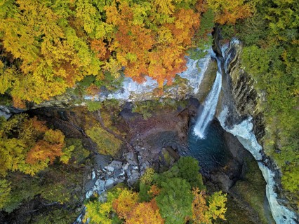 Aerial view of Berglistüber waterfall in autumn-colored surroundings, Linthal, Klausenpass, Canton