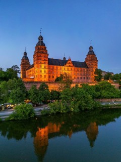 Aerial view, drone photo: Johannisburg Castle illuminated in the evening and castle terrace over