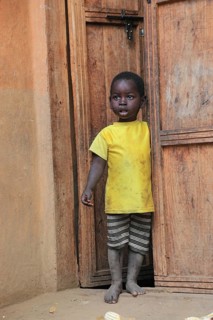 South Ethiopia, Ari people, little boy standing in the front door, Ethiopia
