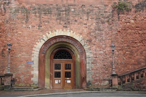 Cellar entrance to Mainzer Actien Bierbrauerei, red stone wall, door, Mainz, Rhineland-Palatinate,