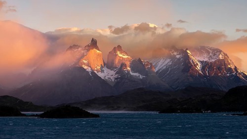 Cuernos del Paine in morning light with clouds and Lake Pehoé in the foreground, Torres del Paine