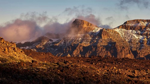 Mirador El Tabonal Negro, caldera, mountain landscape with clouds illuminated in warm light casting