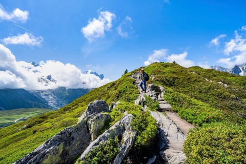 Mountaineers on a hiking trail with mountain views, hiking to the Aiguillette des Posettes,