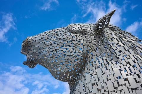 An impressive metal sculpture of a horse's head against a bright blue sky, Ardrishaig, Loch Fyne,
