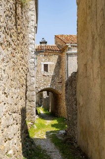 A little road going through the small village Lubenice on a sunny day on the island of Cres,