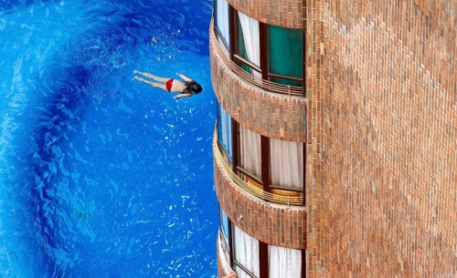 Benidorm, 26.08.09 JE - A girl swims in the pool of a hotel, Spain
