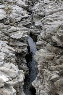 Rocks, granite rock formations in the Maggia River near Ponte Brolla, in the Maggia Valley, Valle