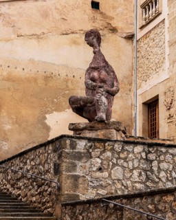 Figura Sentada de Joan Bennassar, stone figure in front of Pollenca City Hall, Majorca, Balearic