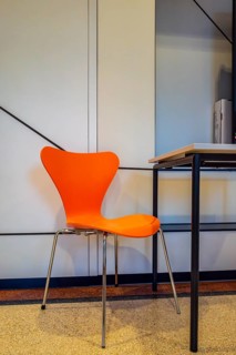 Colourful wooden chairs in the sixties style in a room in the Museum of Communication on Leipziger