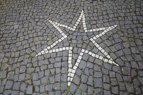 Floor mosaic with white pentagonal star, pointed, square, paving stones, monochrome, black and