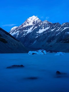 Mountainous landscape. Hooker Lake and Aoraki Mount Cook. Evening mood, blue hour. Aoraki Mount