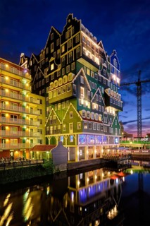 ZAANDAM, NETHERLANDS, MAY 21, 2018: Inntel Hotel in Zaandam illuminated at night. Design of