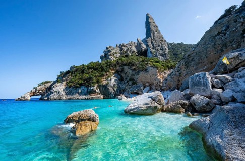 Light blue clear sea on a dream beach on Cala Goloritzé, picturesque rocky coast, steep coast with
