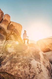 Woman hiking at sunrise in Joshua Tree National Park