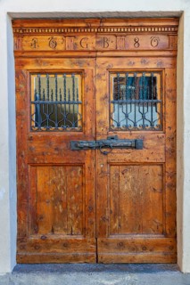 Old wooden door. Historical centre, Chiavenna, Valtellina, Lombardy, Italy