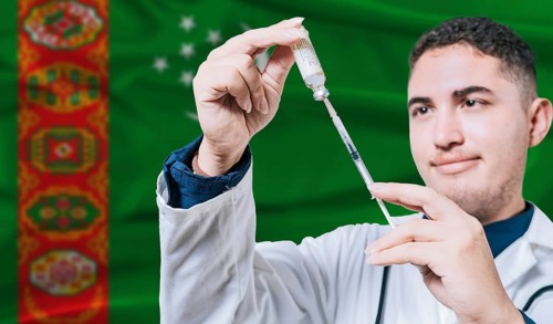 Doctor holding syringe on Turkmenistan flag background. Medical professional holding syringe with