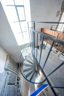 Winding staircase in a church building with light coming through a window, Deufringen, Aidlingen,