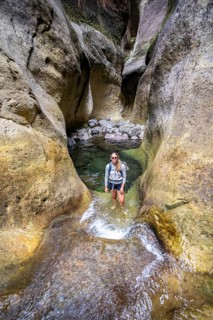 Female hiker in the Tugela Gorge or Tugela Gorge in the riverbed, Drakensberg National Park,