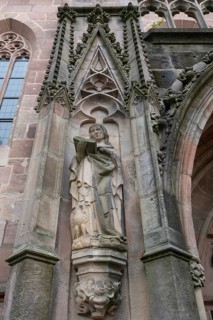 Sculpture to the left of the main entrance portal of St Nicholas and St Ulrich Church, Kirchenberg
