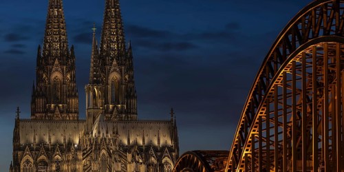 Evening atmosphere, Cologne Cathedral illuminated with LED lamps and the Hohenzollern Bridge,