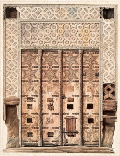 Elaborately decorated wooden door with geometric patterns and reliefs in ancient architecture