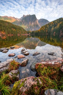Mountain peaks of the Ötztal Alps reflected in Lake Piburger See, in autumn, near Ötz in Ötztal,