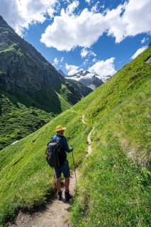 Mountaineer on a hiking trail in Umbaltal, Venediger Group, Hohe Tauern National Park, East Tyrol,