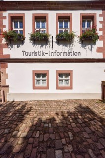 Historic buildings, cobblestones, windows, flower boxes, tourist information, tourist information