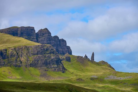 Green mountain landscape with characteristic rocks under a cloudy sky, Old Man of Storr, Portree,