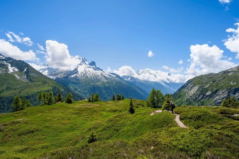 Mountaineers on hiking trail, mountain panorama with glaciated mountain peaks, Aiguille du Midi and