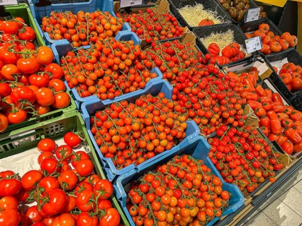 Fruit rack in a supermarket. Tomatoes in various varieties. diversity. Stuttgart,